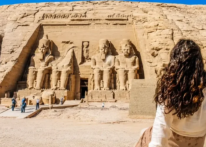 Traveler admiring the colossal Abu Simbel temples during the best time to visit Egypt