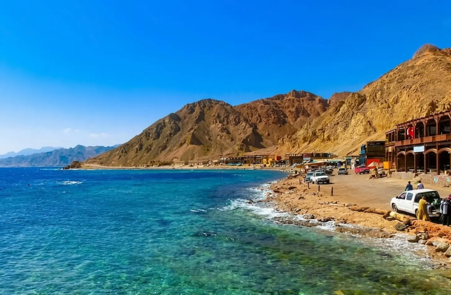 Scenic turquoise waters and rugged desert mountains along the Dahab coastline during a getaway to Egypt in January.